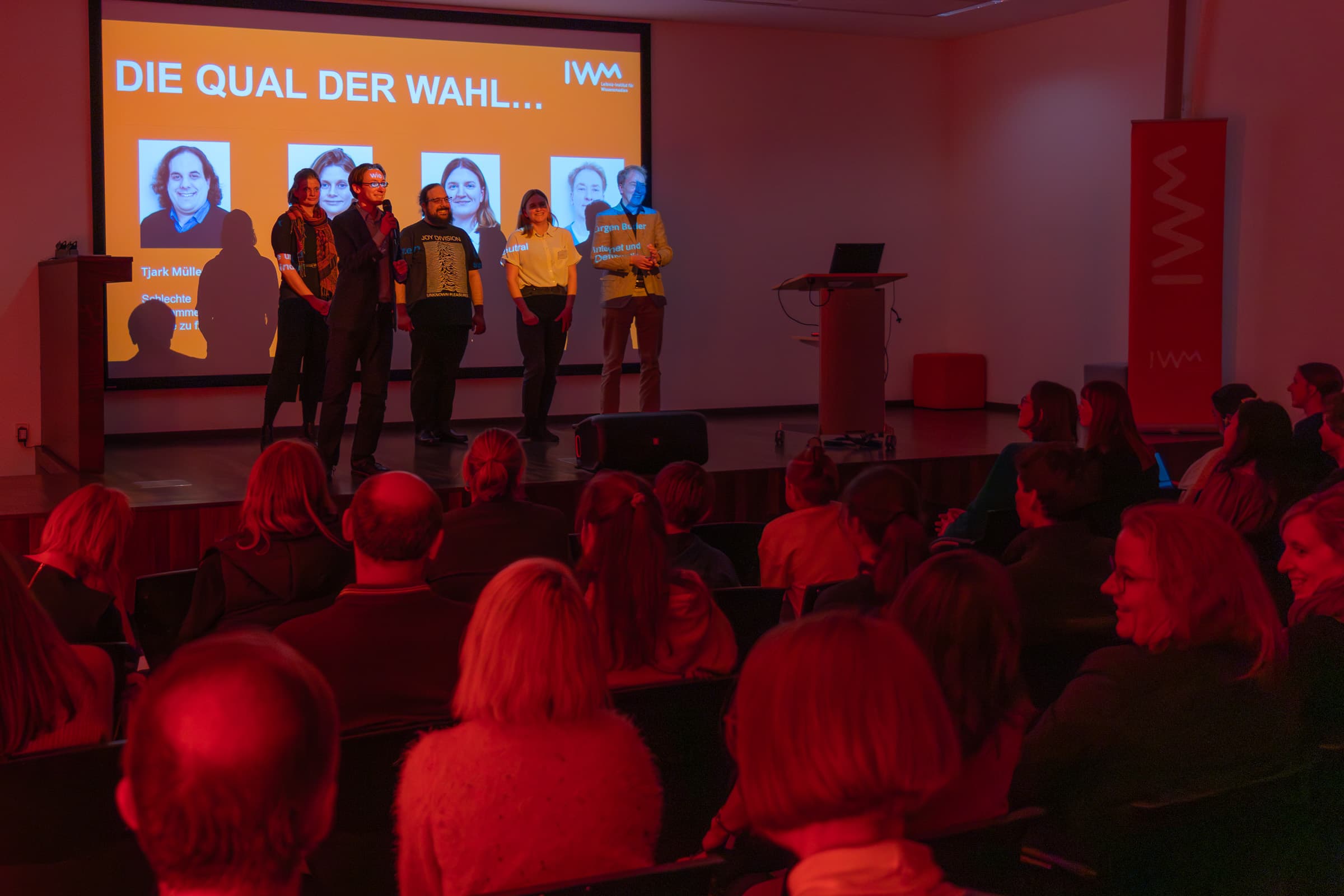Five people on stage at the Science Slam