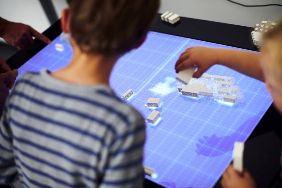 Pupils using the LEGO table
