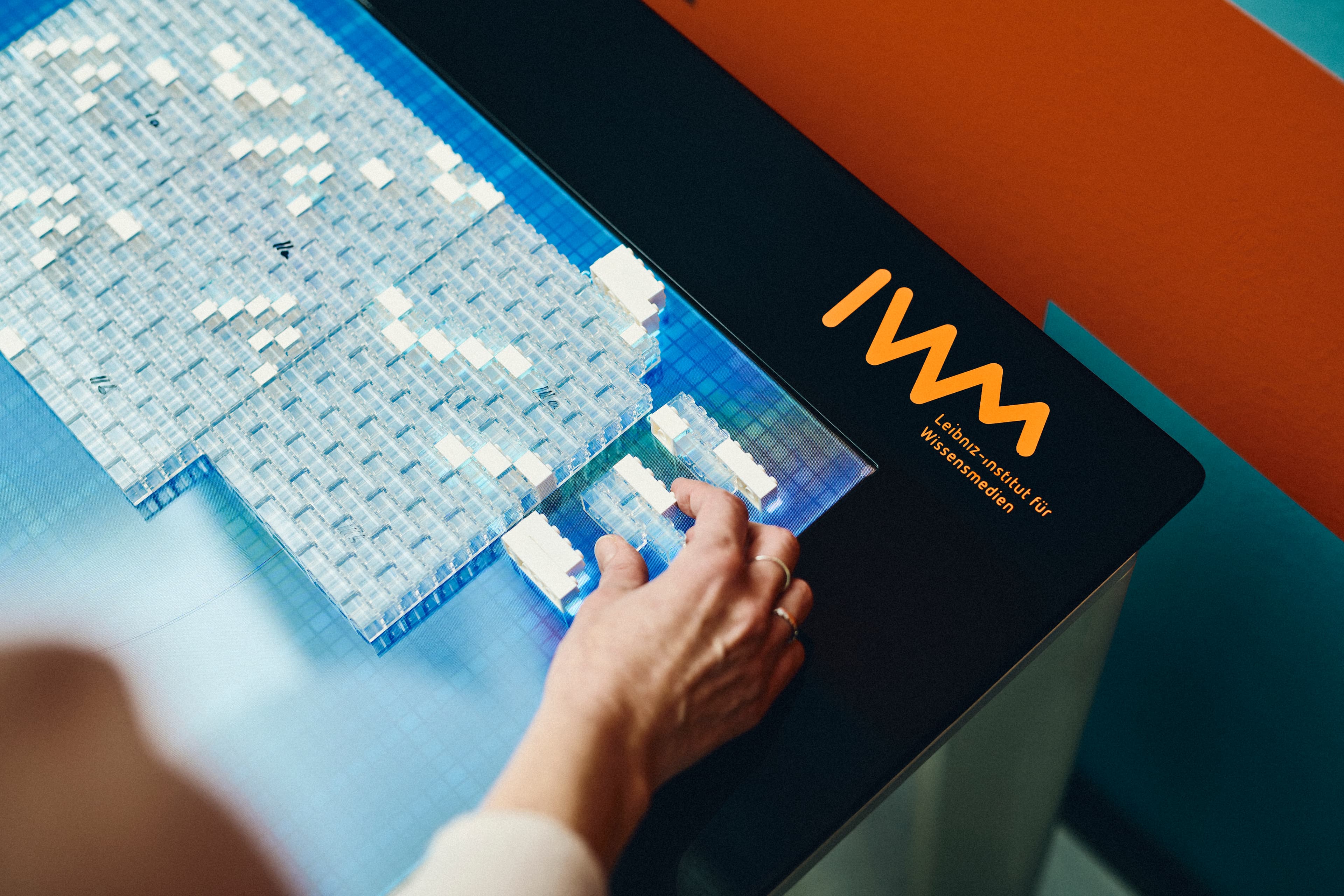 A person using the LEGO table at the IWM